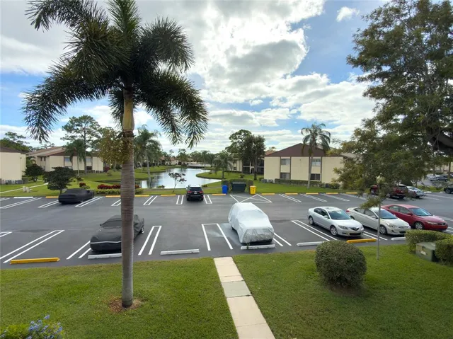 a swimming pool with outdoor seating and yard