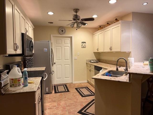 Undisclosed Address Fort Pierce, FL 34951 - Photo 8 of 10 a kitchen with stainless steel appliances granite countertop a sink stove and refrigerator