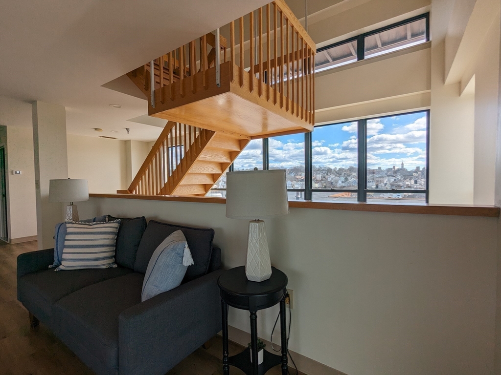 750 Davol Street, Unit 1214 Fall River, MA 02720 - Photo 20 of 42 a view of entryway and hall with wooden floor