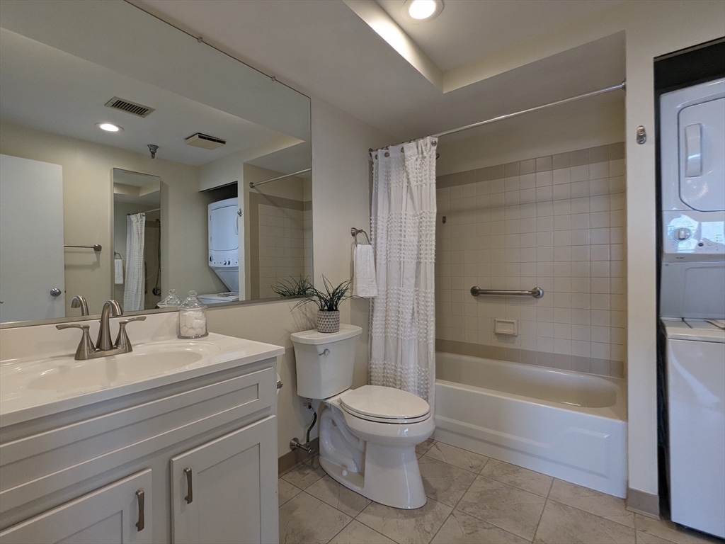 750 Davol Street, Unit 1214 Fall River, MA 02720 - Photo 21 of 42 a bathroom with a sink a toilet and shower