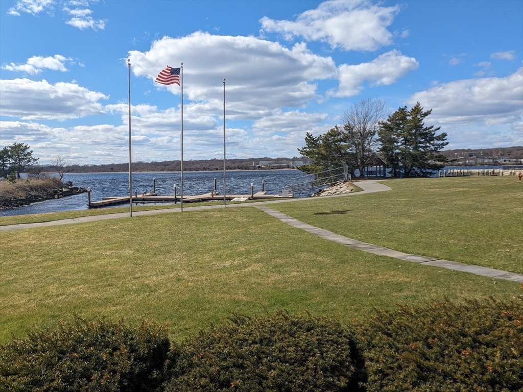 750 Davol Street, Unit 1214 Fall River, MA 02720 - Photo 36 of 42 a view of a swimming pool and an outdoor seating