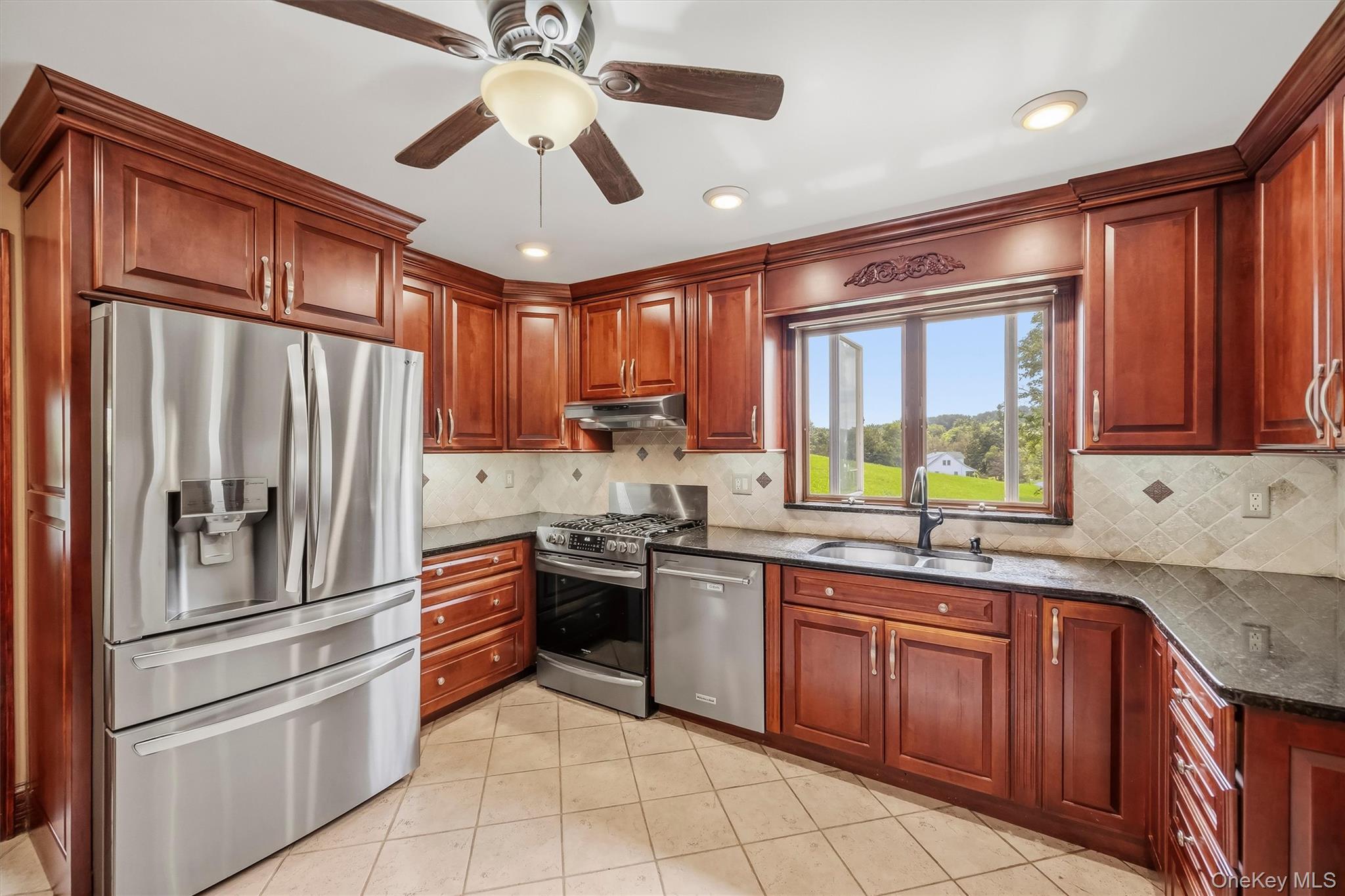 328 Big Island Road Florida, NY 10921 - Photo 13 of 40 Kitchen with wood cabinetry, granite countertops, tile backsplash and stainless steel appliances.