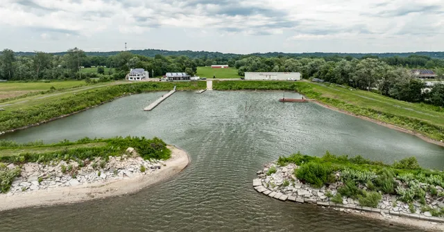 a view of a lake with a yard