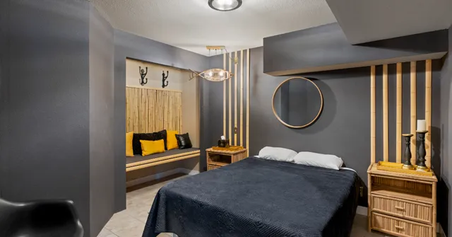 a bedroom with bed and a window