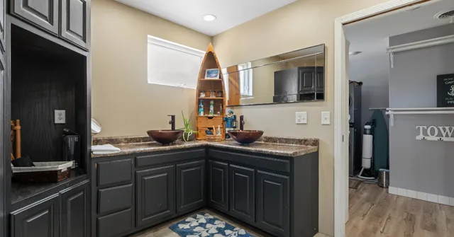 a kitchen with a sink and cabinets