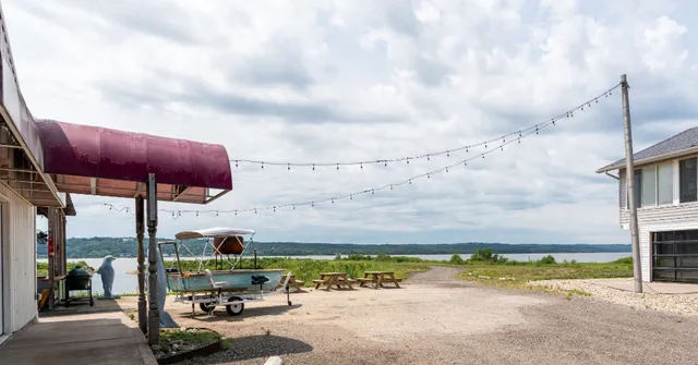 a view of a swimming pool with a yard