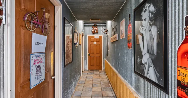 a view of a entryway door with wooden floor