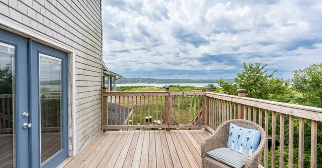 a view of balcony with furniture