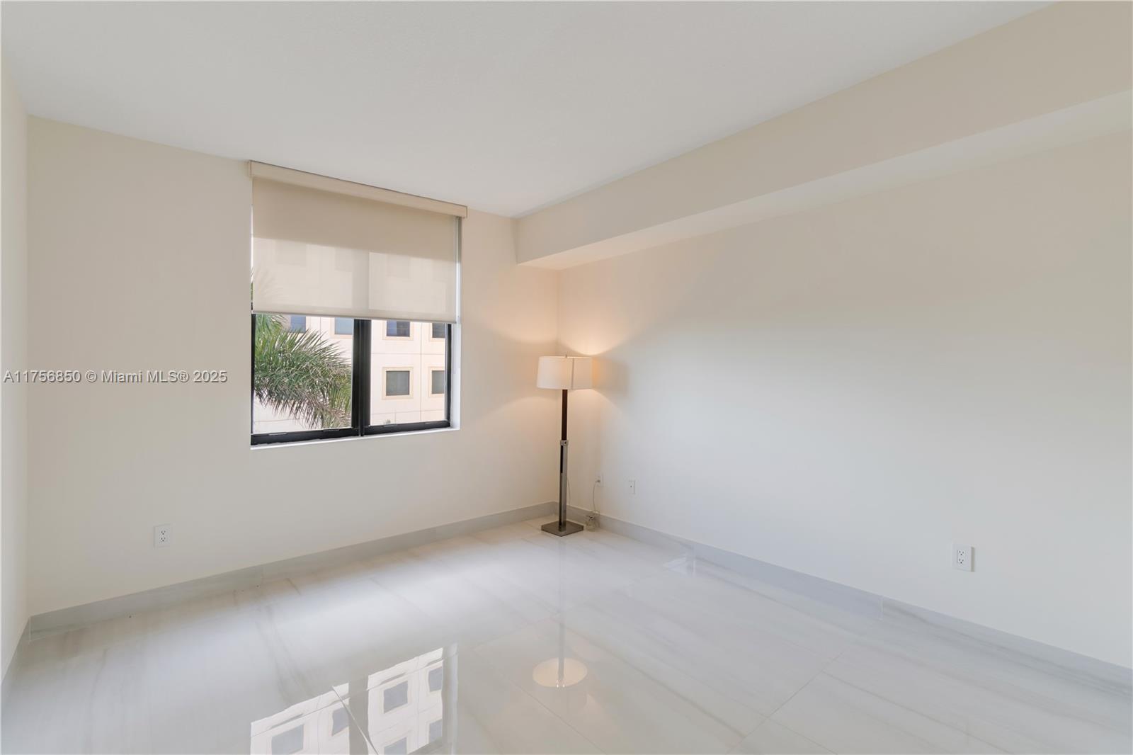 888 Douglas Road, Unit 404 Coral Gables, FL 33134 - Photo 12 of 21 an empty room with windows