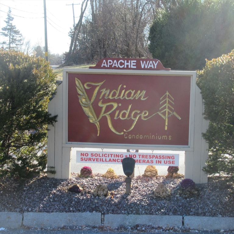 52 Apache Way, Unit 52 Tewksbury, MA 01876 - Photo 1 of 19 a sign that is on the side of a building