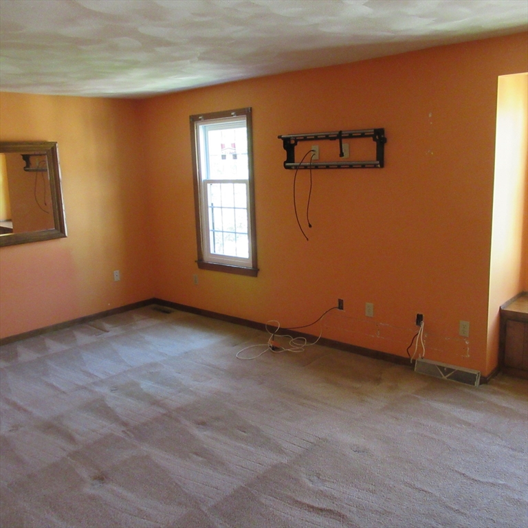 52 Apache Way, Unit 52 Tewksbury, MA 01876 - Photo 14 of 19 an empty room with windows