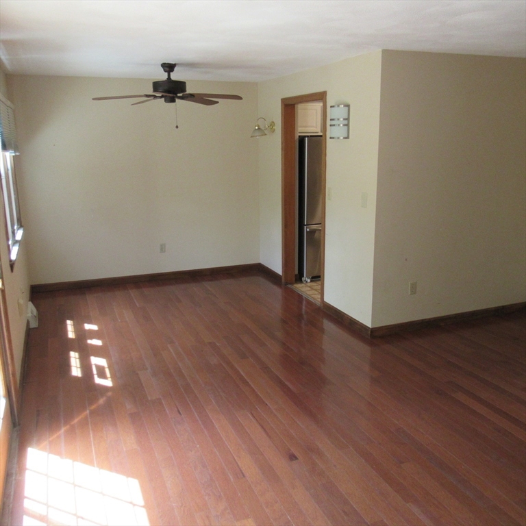 52 Apache Way, Unit 52 Tewksbury, MA 01876 - Photo 8 of 19 a view of a room with wooden floor