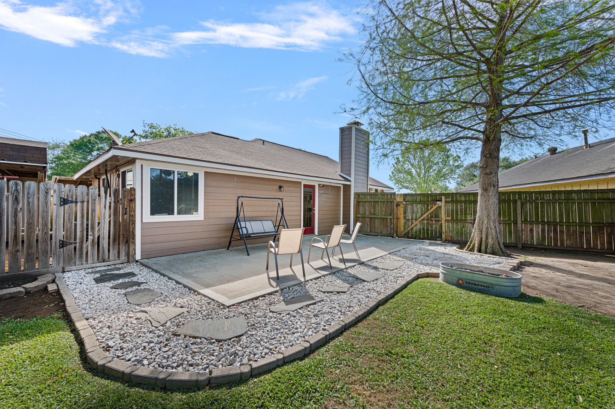 1804 Spruce Drive Rosenberg, TX 77471 - Photo 24 of 29 a view of a house with backyard porch and sitting area