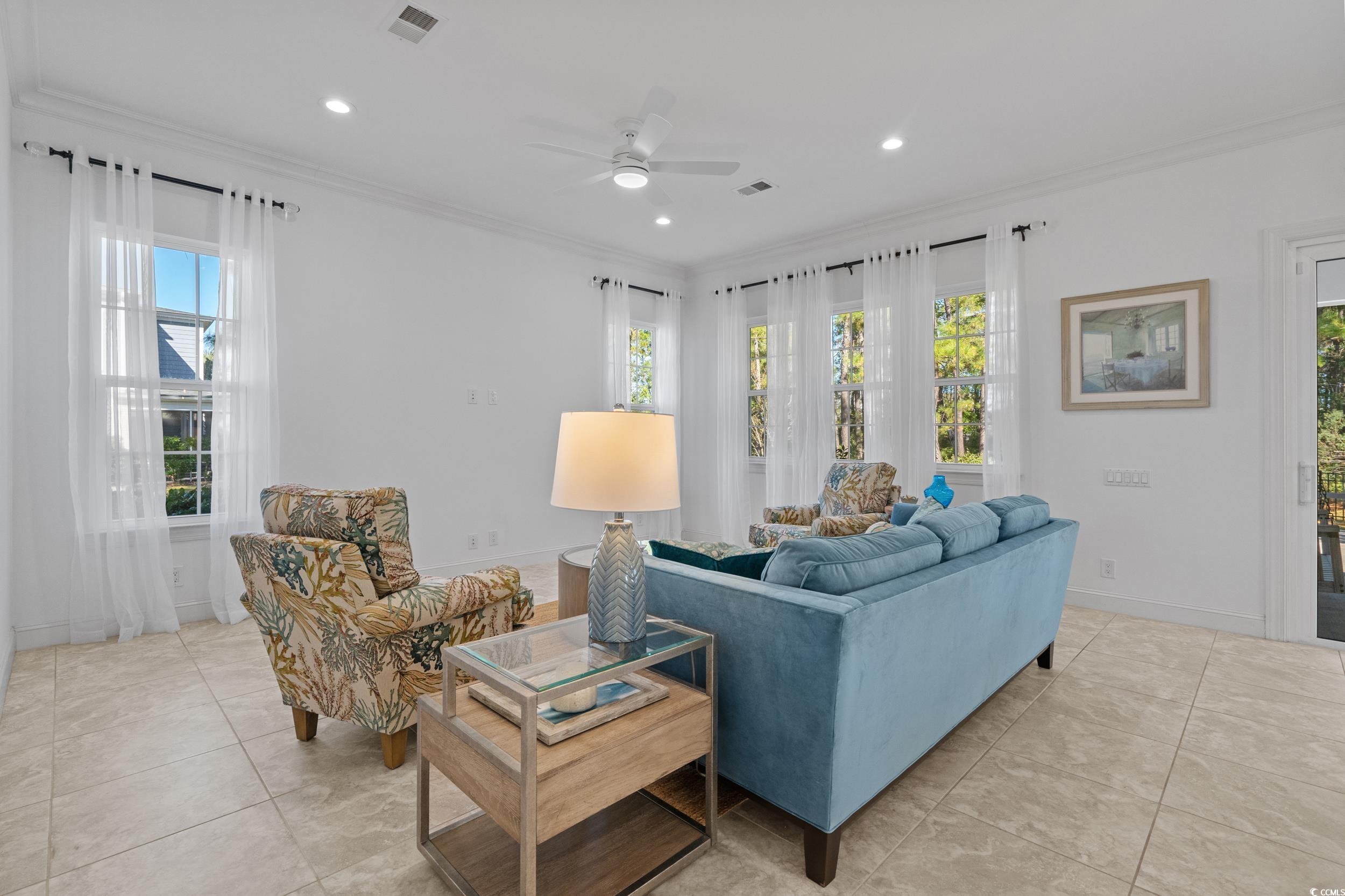 496 Starlit Way Myrtle Beach, SC 29579 - Photo 11 of 40 Living area featuring crown molding, plenty of natural light, light tile patterned floors, ceiling fan, and recessed lighting