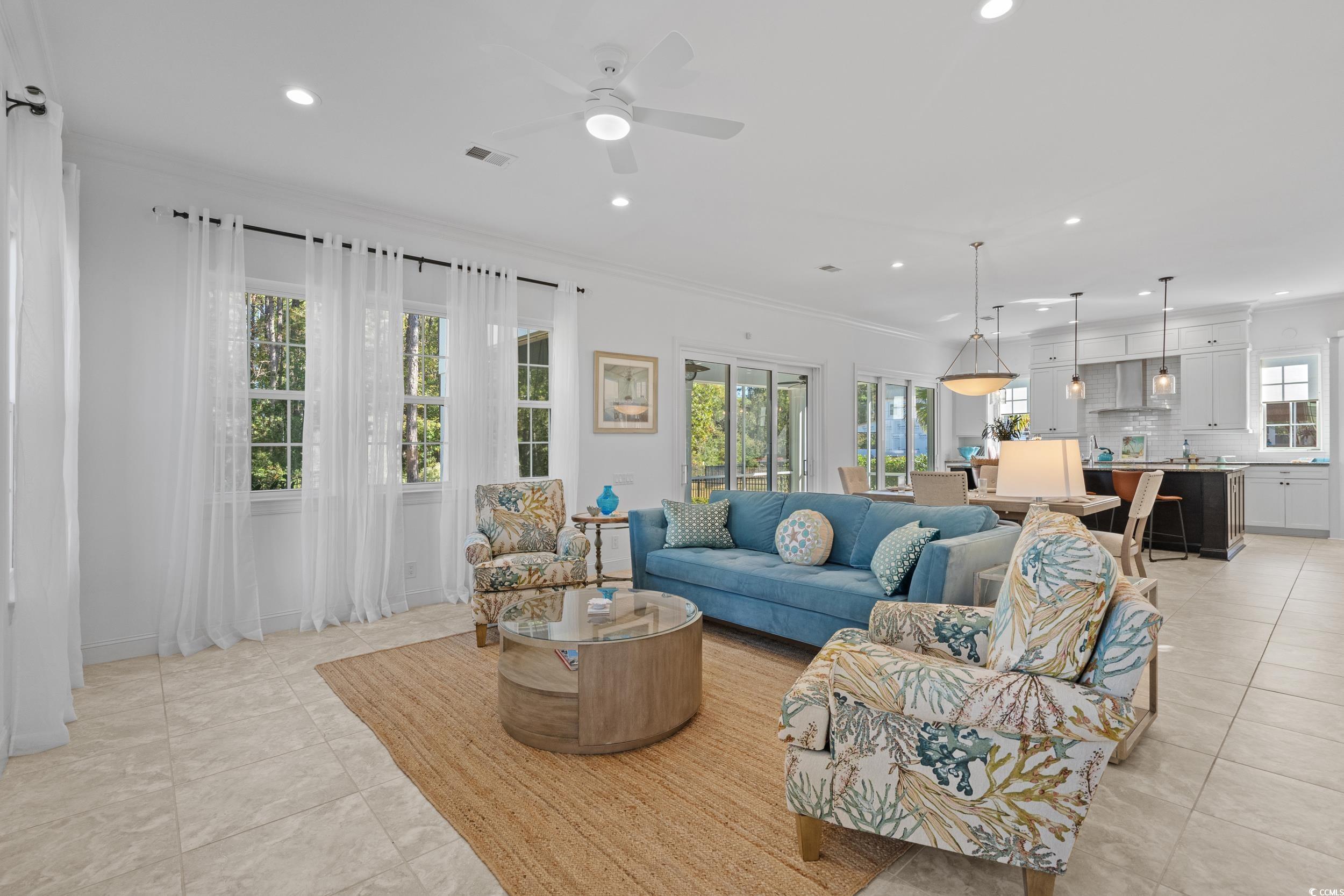 496 Starlit Way Myrtle Beach, SC 29579 - Photo 12 of 40 Living room with ornamental molding, recessed lighting, light tile patterned flooring, and ceiling fan