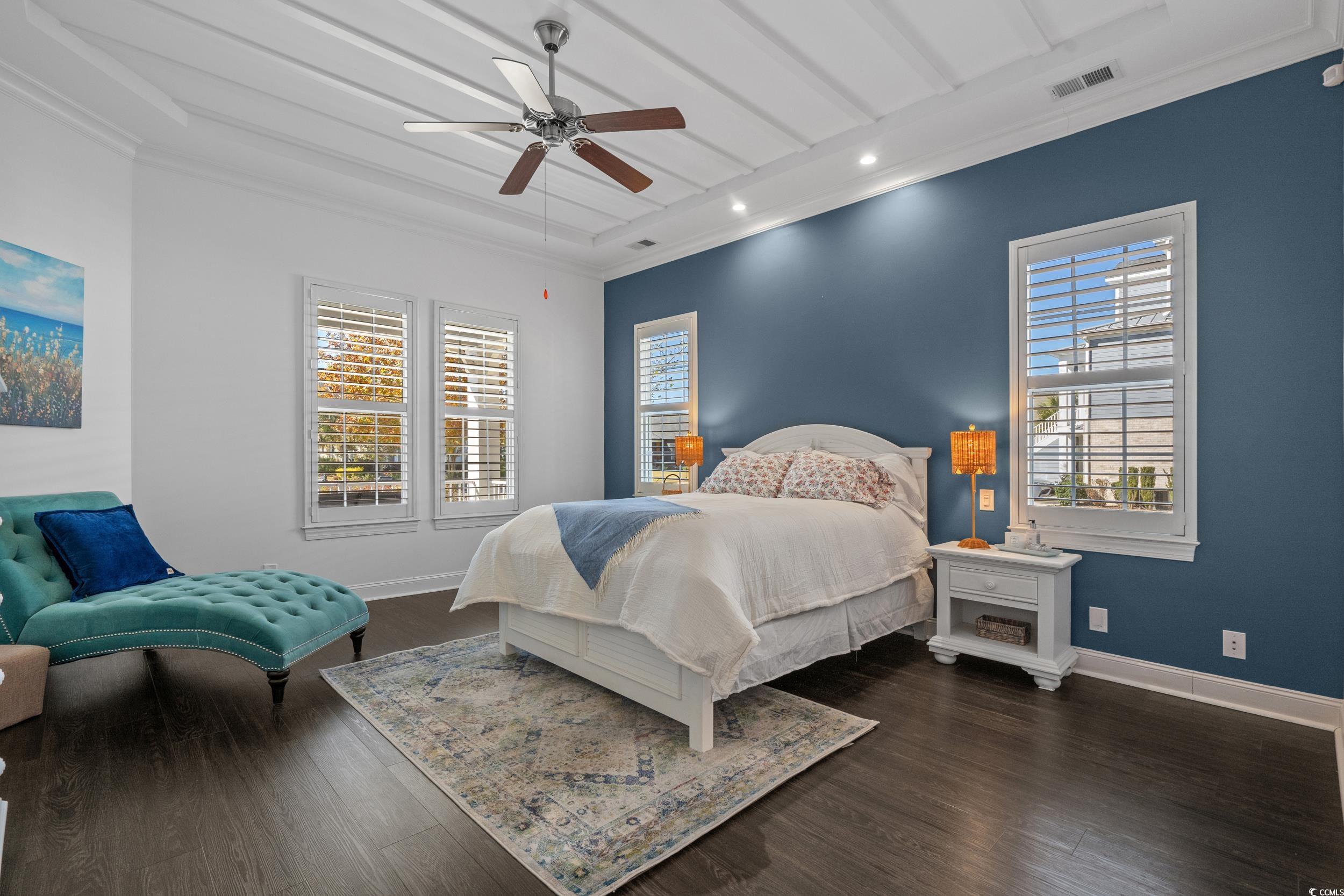496 Starlit Way Myrtle Beach, SC 29579 - Photo 25 of 40 Bedroom featuring dark wood-style flooring, recessed lighting, a ceiling fan, crown molding, and beam ceiling