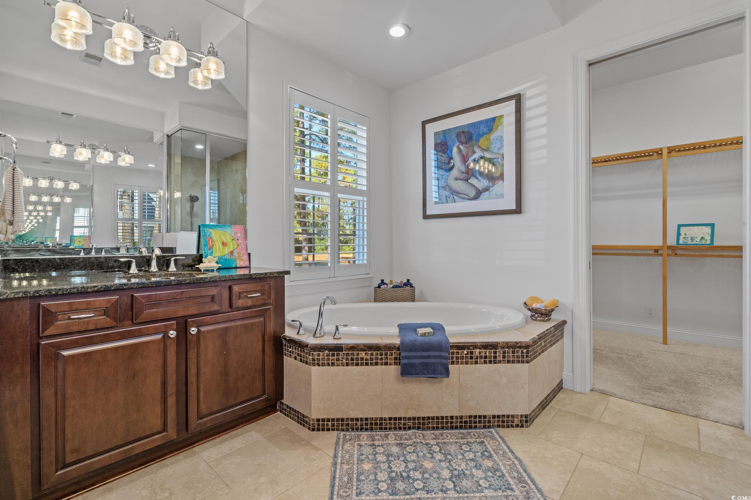 496 Starlit Way Myrtle Beach, SC 29579 - Photo 28 of 40 Full bath with vanity, a bath, light tile patterned flooring, recessed lighting, and a spacious closet