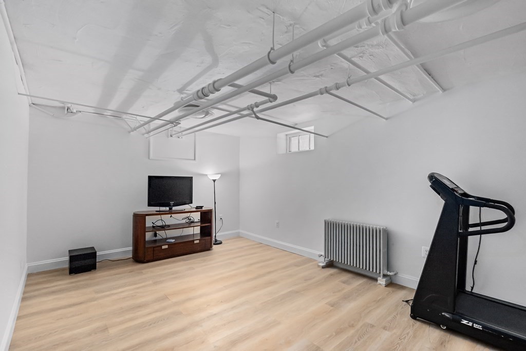 72 Salisbury Road Brookline, MA 02445 - Photo 29 of 40 a view of a room with gym equipment and wooden floor