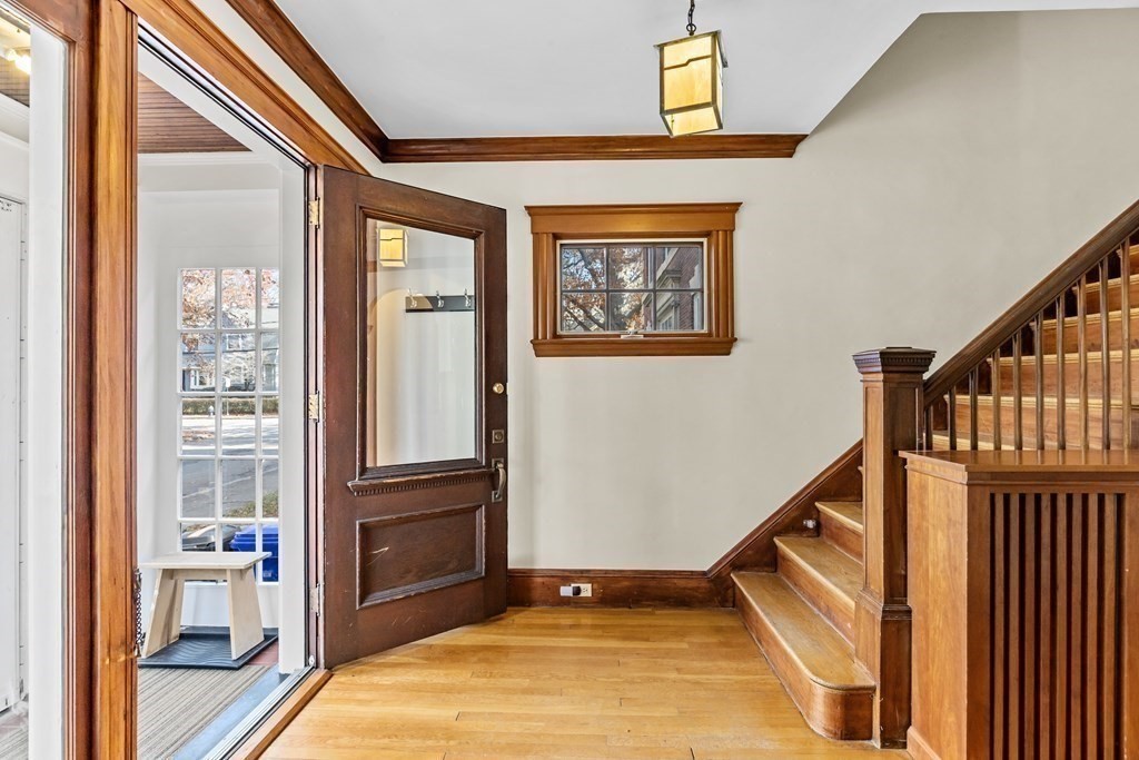 72 Salisbury Road Brookline, MA 02445 - Photo 5 of 40 a view of a hallway with wooden floor and staircase