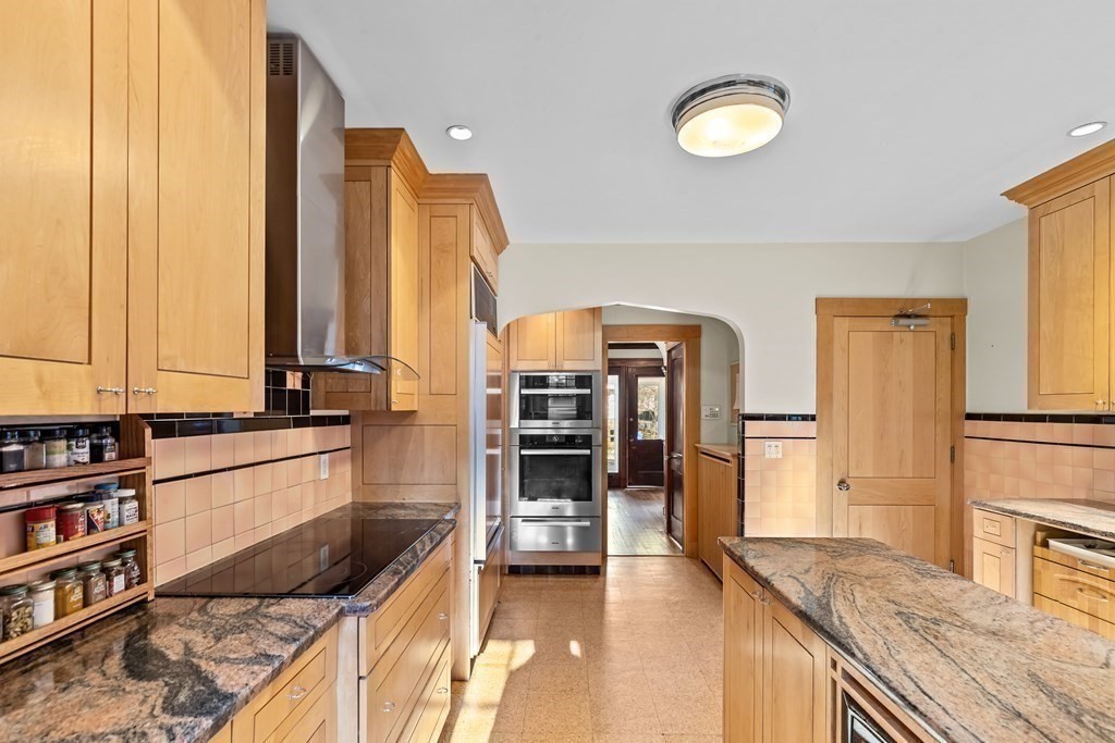 72 Salisbury Road Brookline, MA 02445 - Photo 8 of 40 a kitchen with stainless steel appliances granite countertop a stove and a refrigerator