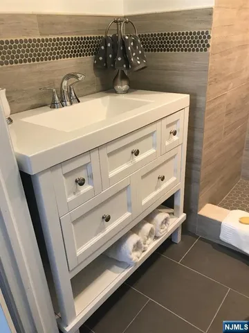 a bathroom with a sink and a mirror