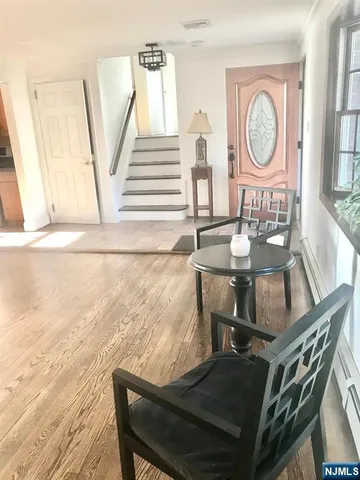 a view of a dining room with furniture and a window