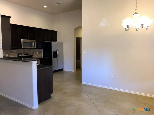 a view of a kitchen with a sink