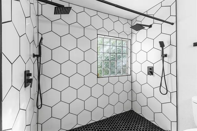 a bathroom with a white shower curtain
