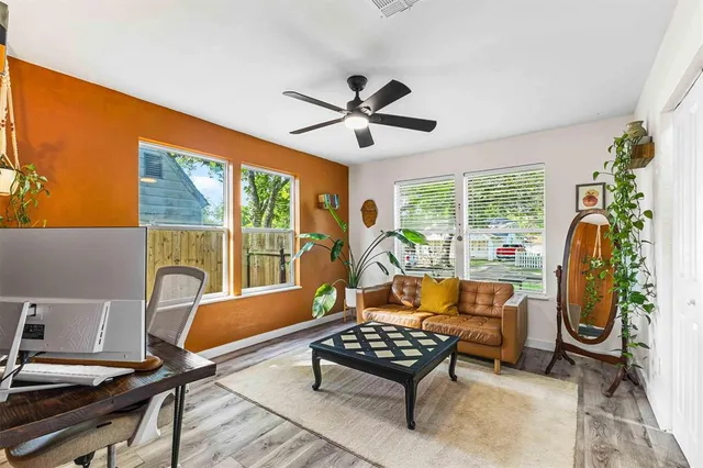 a living room with furniture and a window