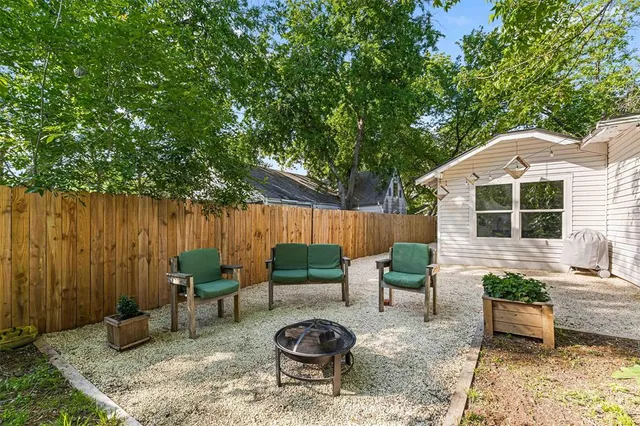 a backyard of a house with seating space