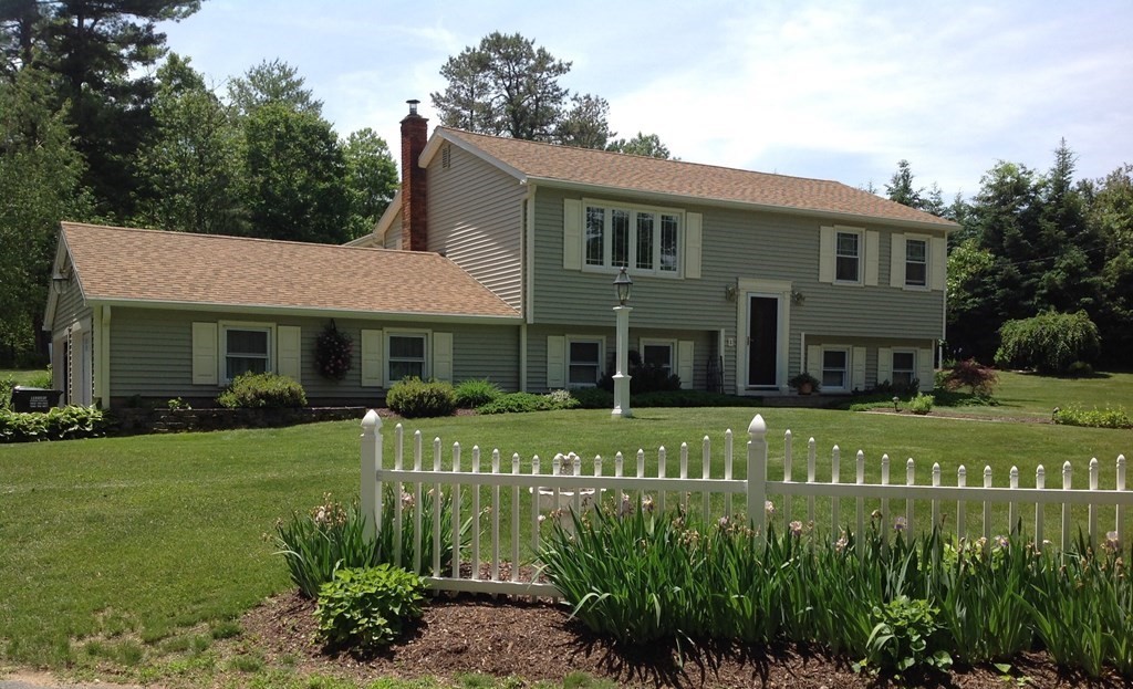 30 Meadow Road Ware, MA 01082 - Photo 1 of 26 a front view of a house with a garden