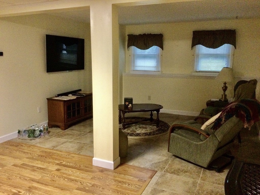 30 Meadow Road Ware, MA 01082 - Photo 21 of 26 a living room with furniture and a flat screen tv
