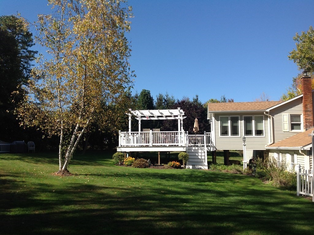 30 Meadow Road Ware, MA 01082 - Photo 3 of 26 a front view of a house with a garden