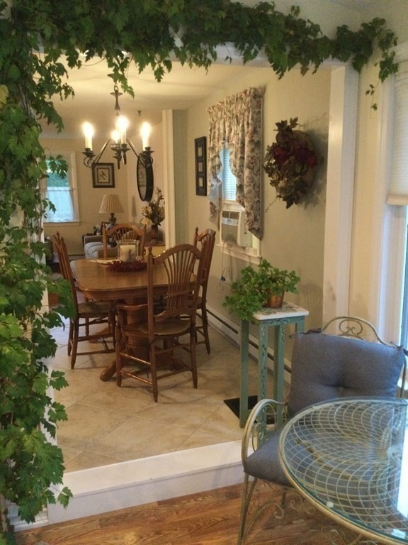 30 Meadow Road Ware, MA 01082 - Photo 6 of 26 a view of a dining room with furniture and a potted plant