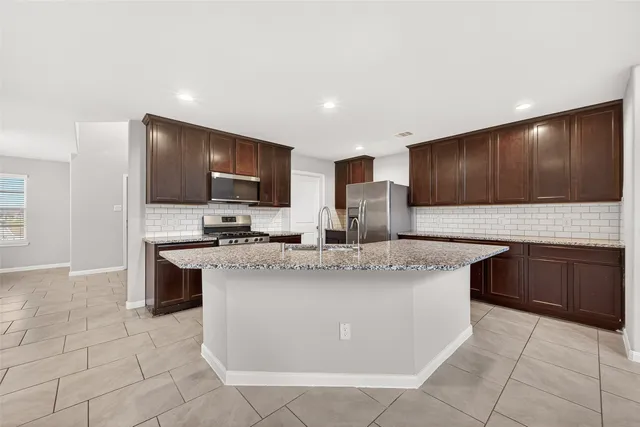 a view of entryway with white walls and stairs
