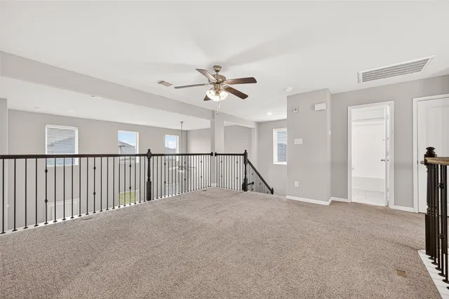 a view of a hallway with a livingroom