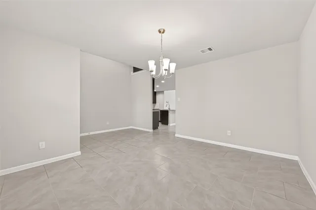 a view of a chandelier in an empty room