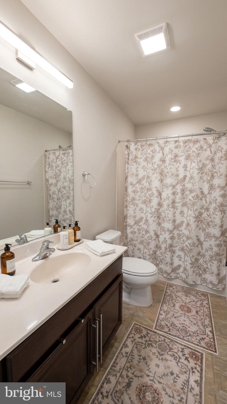 17143 Gibson Mill Road Dumfries, VA 22026 - Photo 10 of 35 Elegant bathroom with floral accents.