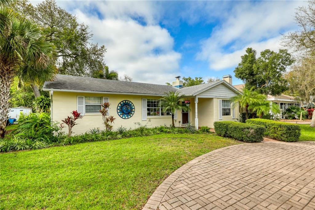 10 Victoria Road Largo, FL 33774 - Photo 1 of 1 a front view of a house with a garden and yard