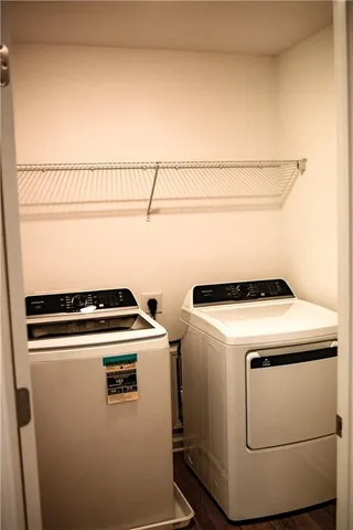 a view of an empty room with wooden walls