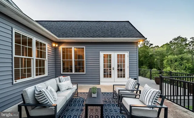 a view of an outdoor sitting area and furniture