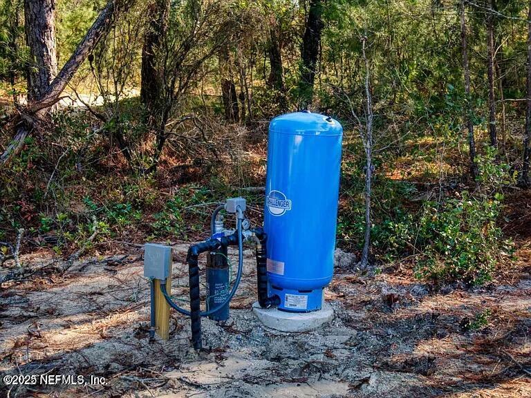 5915 Oak Leaf Road Keystone Heights, FL 32656 - Photo 11 of 44 a view of a chairs in a backyard