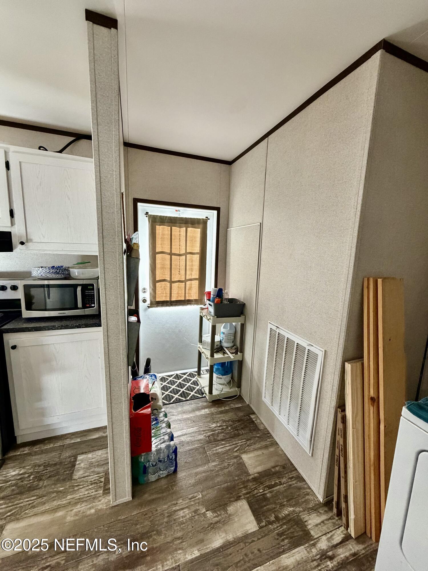 5915 Oak Leaf Road Keystone Heights, FL 32656 - Photo 19 of 44 a bedroom with furniture and a window