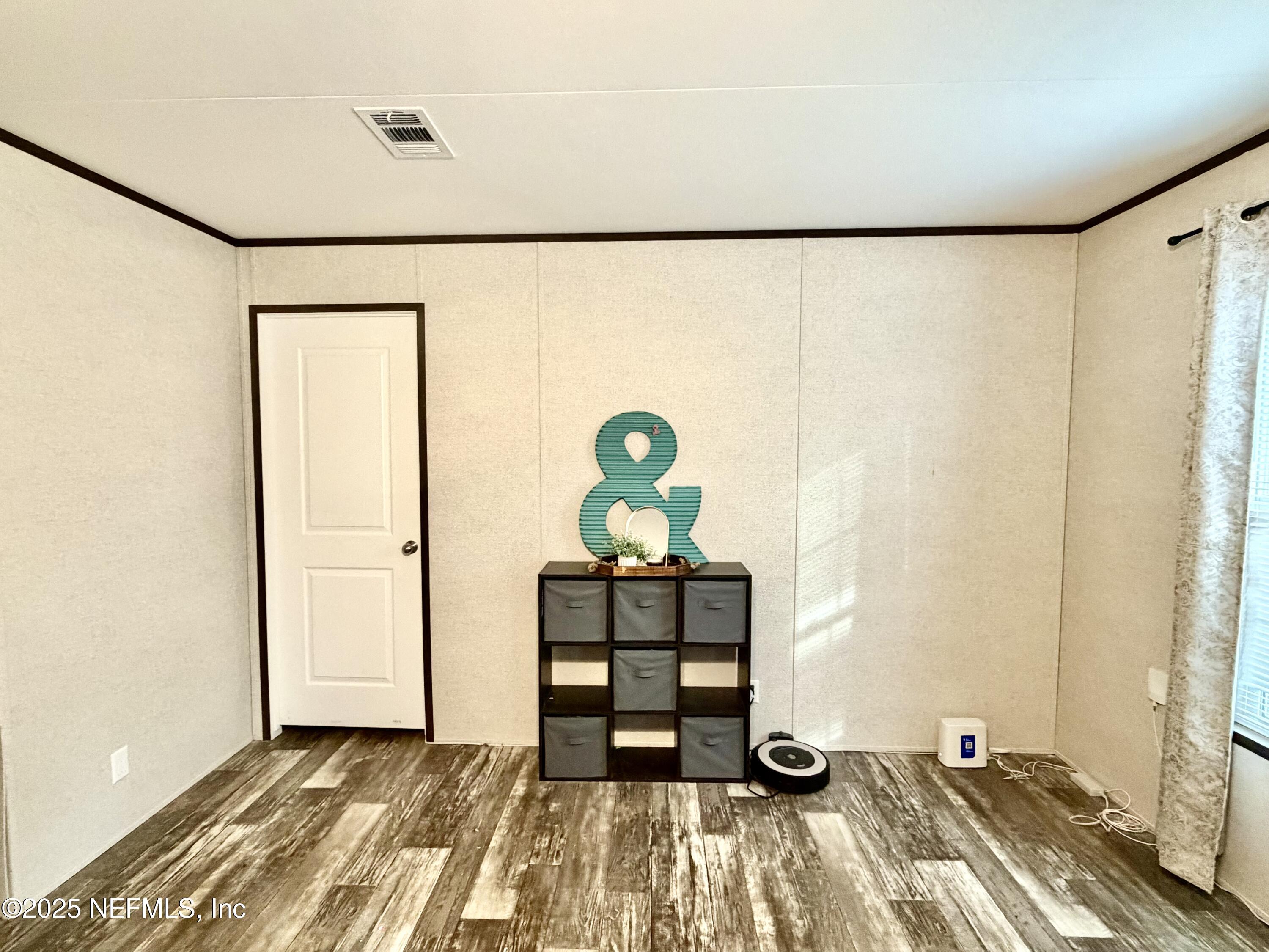 5915 Oak Leaf Road Keystone Heights, FL 32656 - Photo 35 of 44 a view of a room with wooden floor