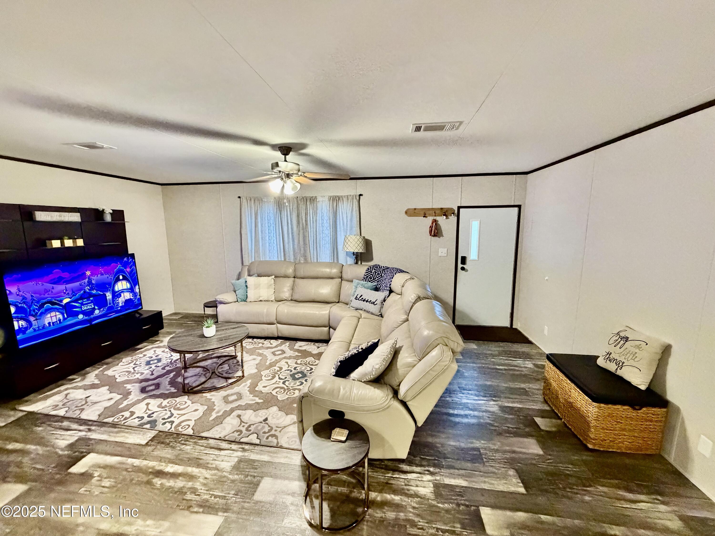 5915 Oak Leaf Road Keystone Heights, FL 32656 - Photo 37 of 44 a bedroom with furniture and a bed