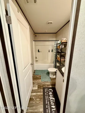 a bathroom with a sink and toilet