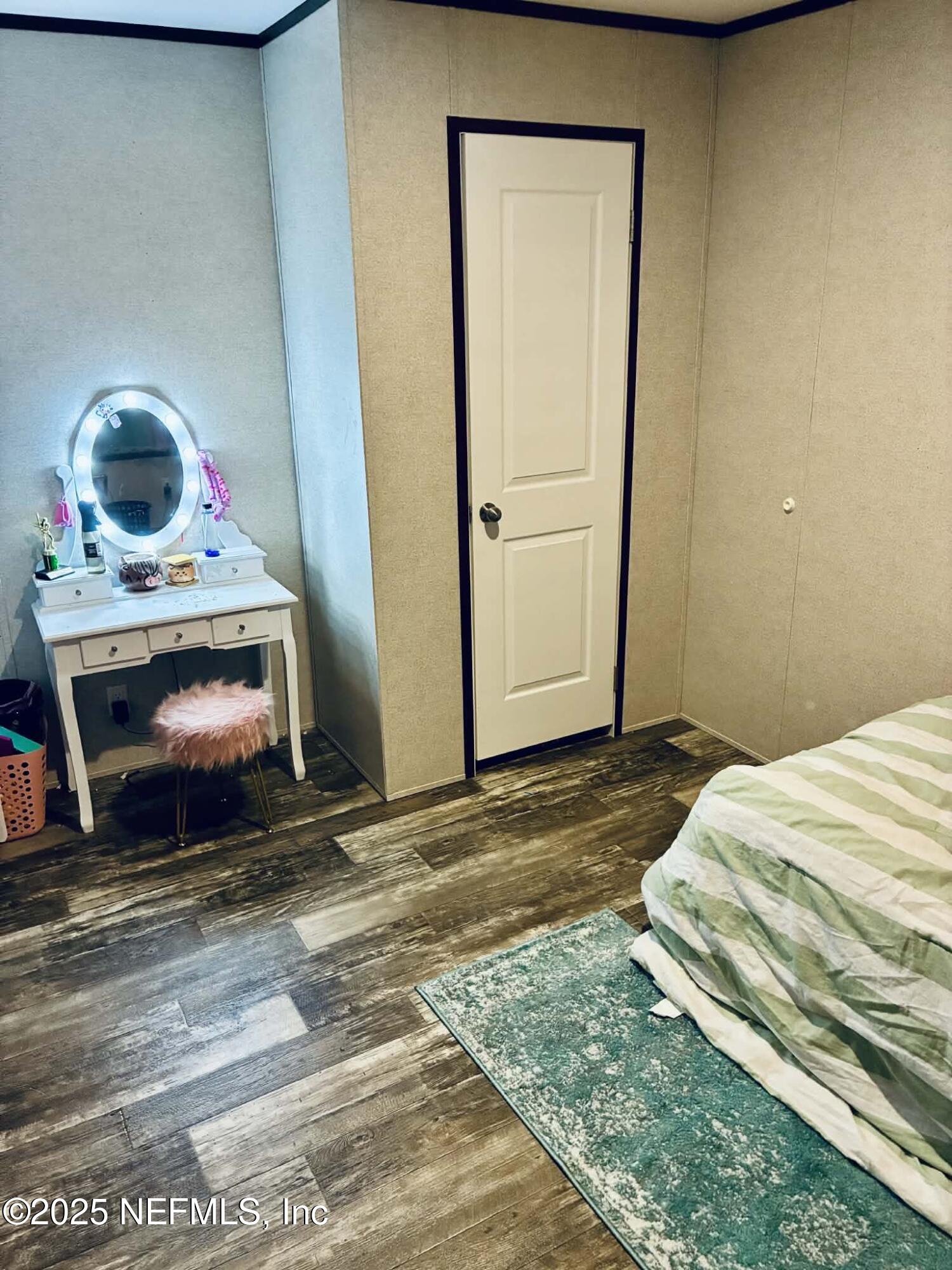 5915 Oak Leaf Road Keystone Heights, FL 32656 - Photo 44 of 44 a bedroom with a bed and a mirror