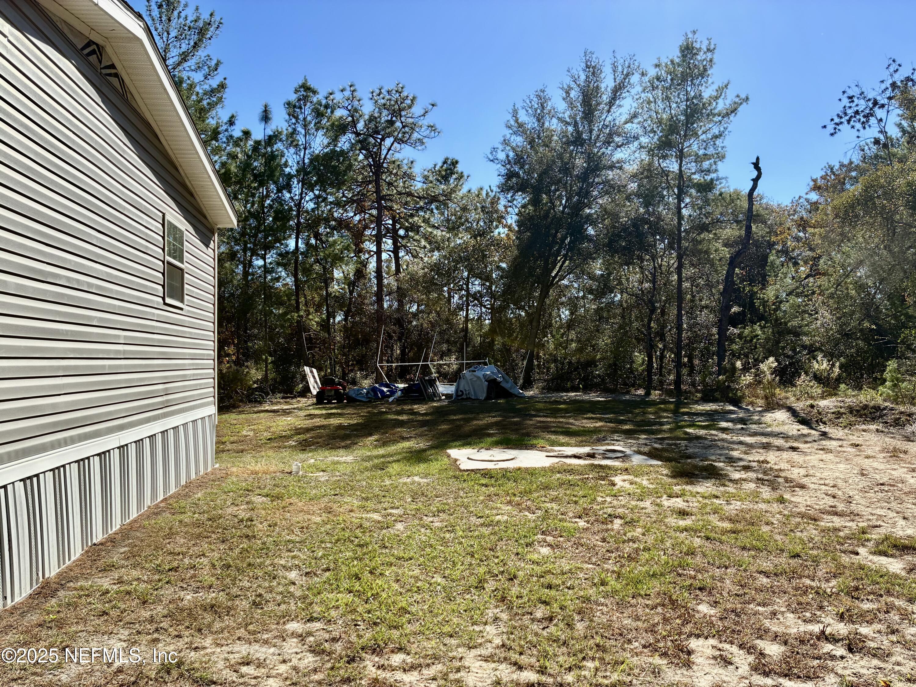 5915 Oak Leaf Road Keystone Heights, FL 32656 - Photo 5 of 44 a view of a swimming pool with a patio