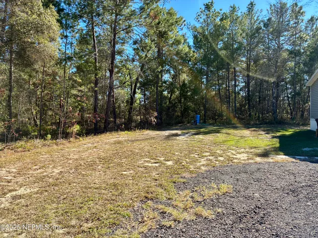 a view of swimming pool with a yard