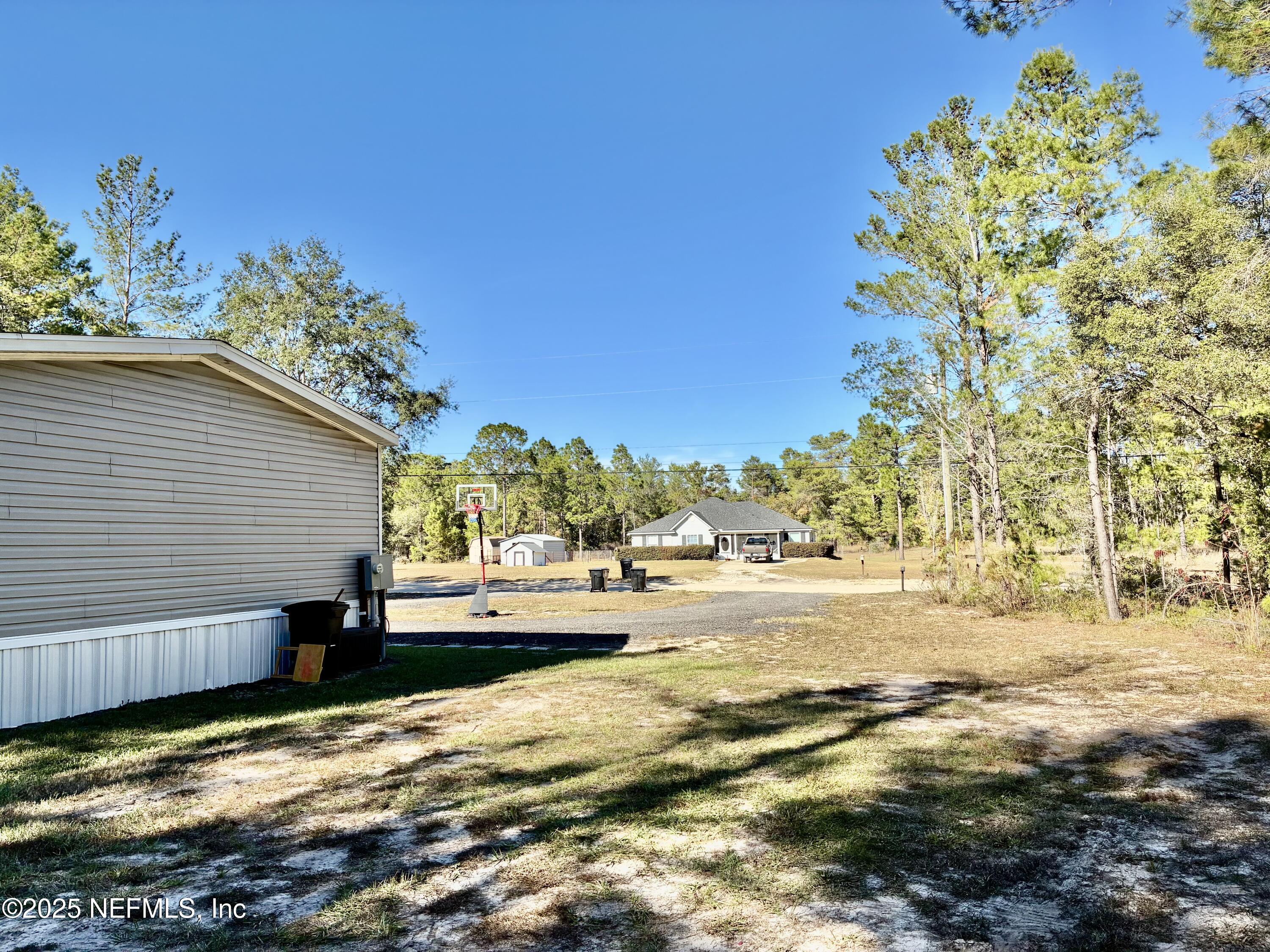 5915 Oak Leaf Road Keystone Heights, FL 32656 - Photo 9 of 44 a view of a house with a yard